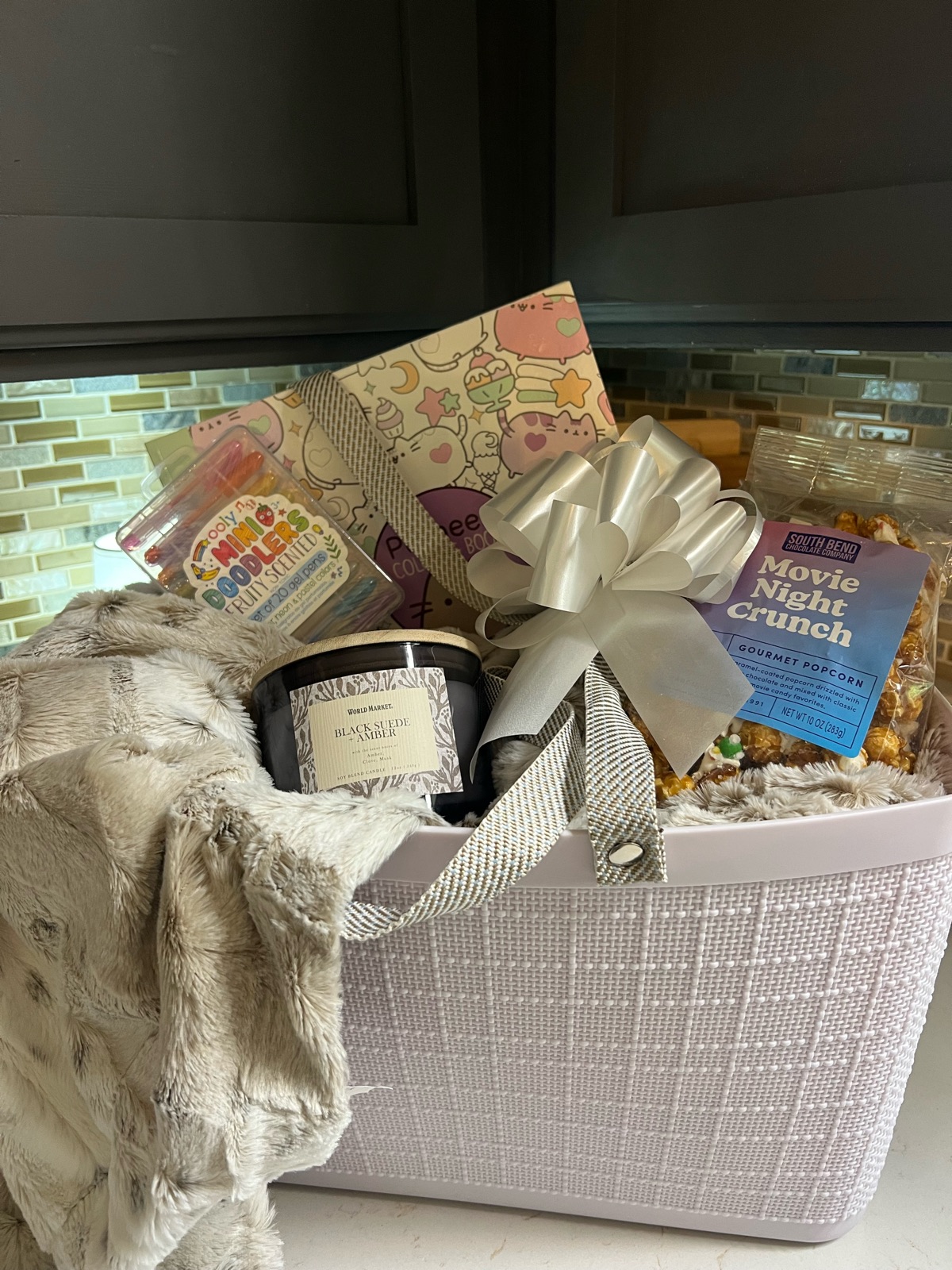 Cozy movie night basket with blanket and popcorn